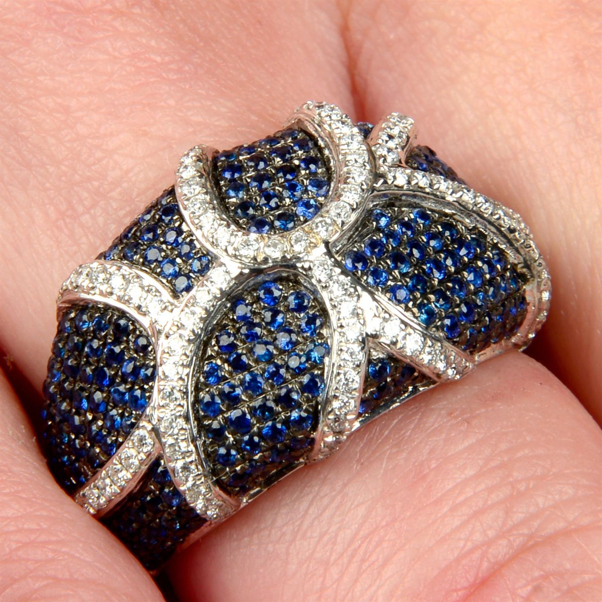 An 18ct gold pavé-set sapphire and brilliant-cut diamond stylised organic dress ring.