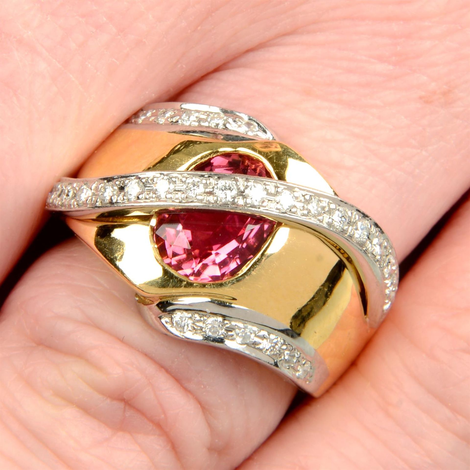 A pink tourmaline and brilliant-cut diamond dress ring.