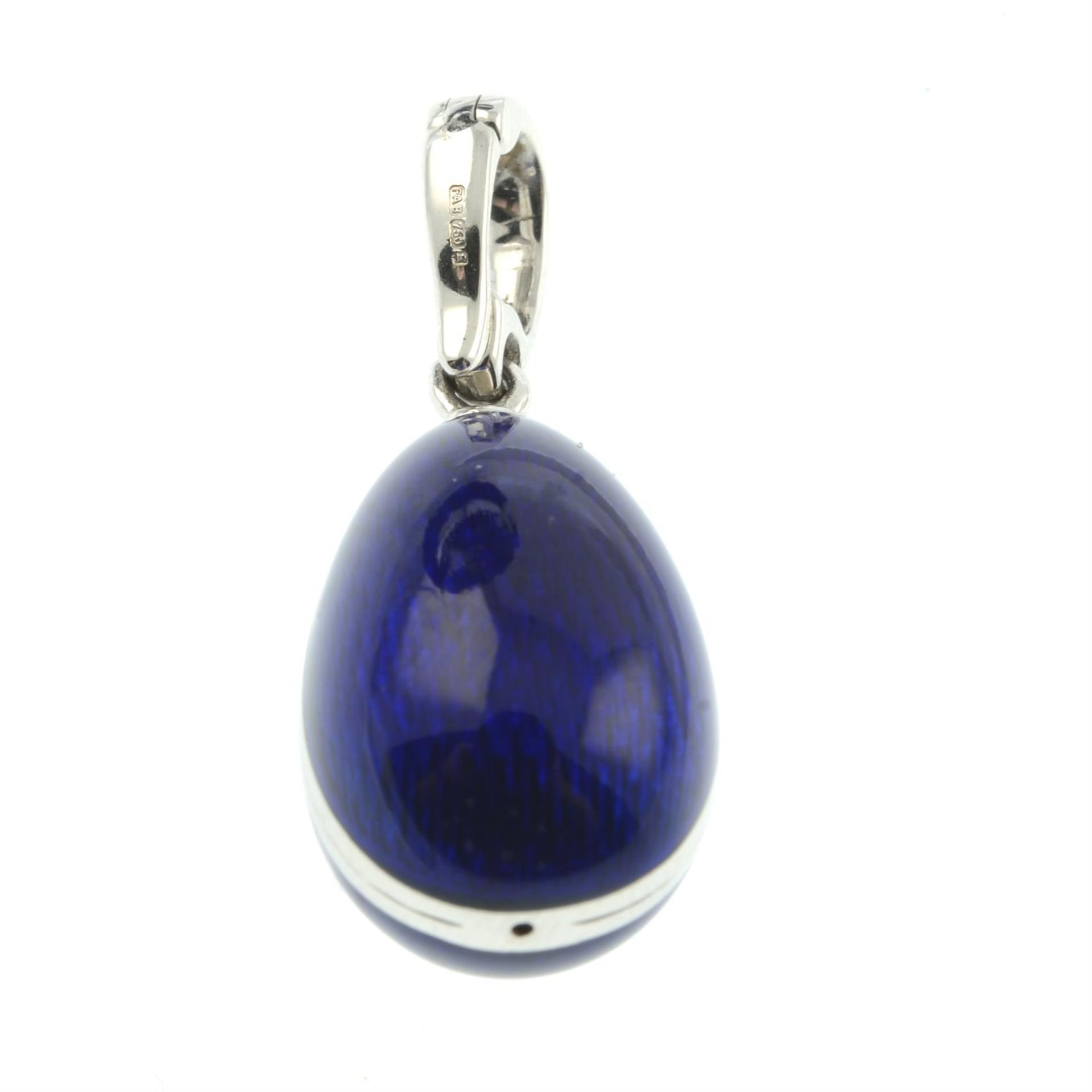 A limited edition 18ct gold blue enamel egg pendant, with diamond swan highlight, by Fabergé. - Image 3 of 5