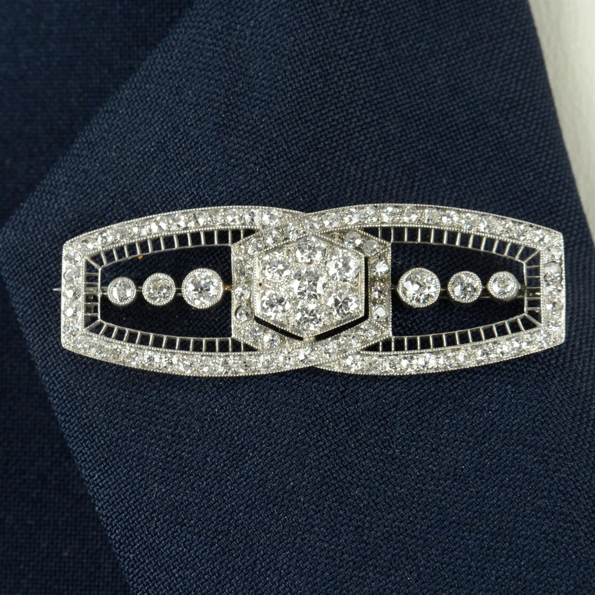 An Art Deco platinum old-cut diamond geometric brooch.