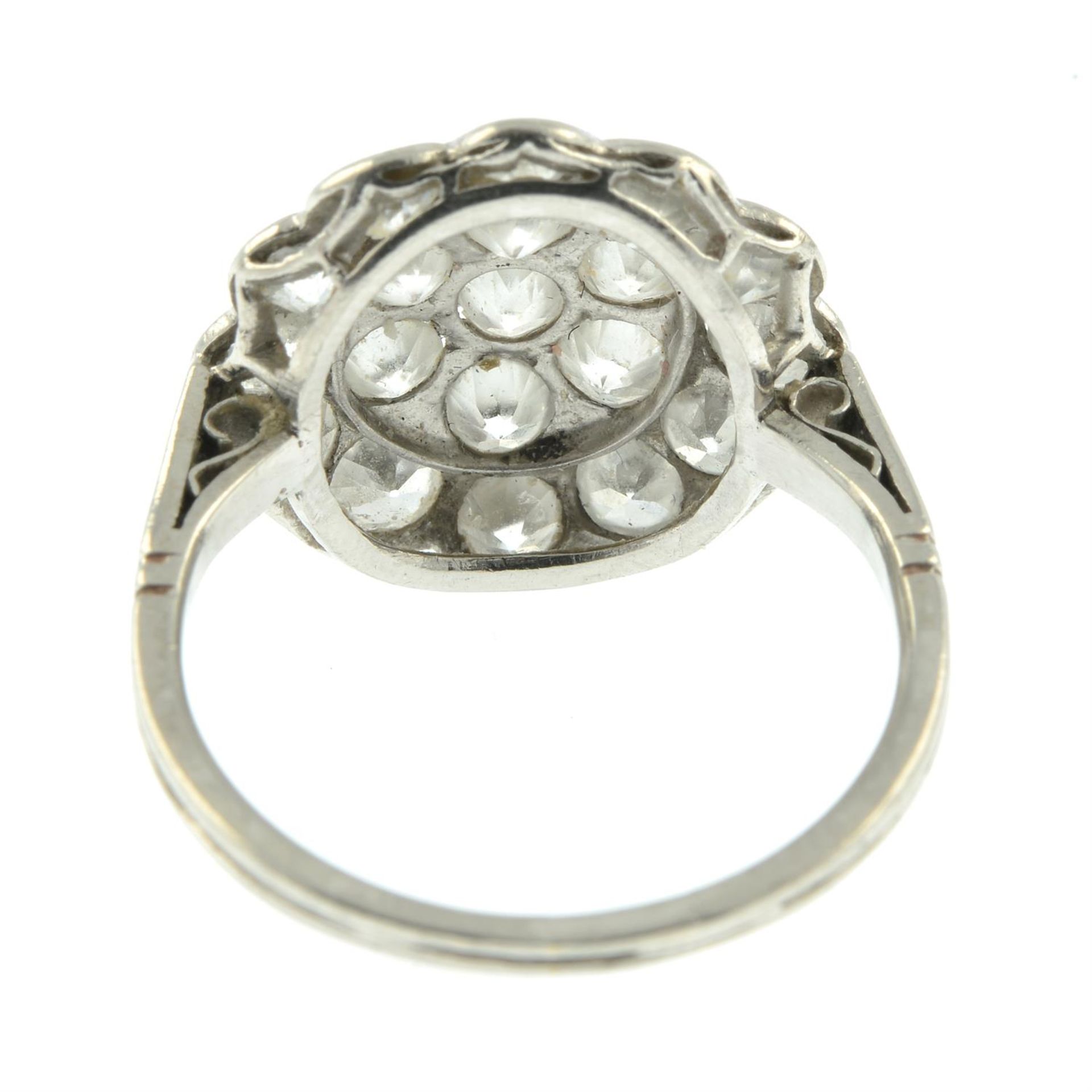 An early to mid 20th century platinum circular-cut diamond cluster ring. - Image 4 of 5