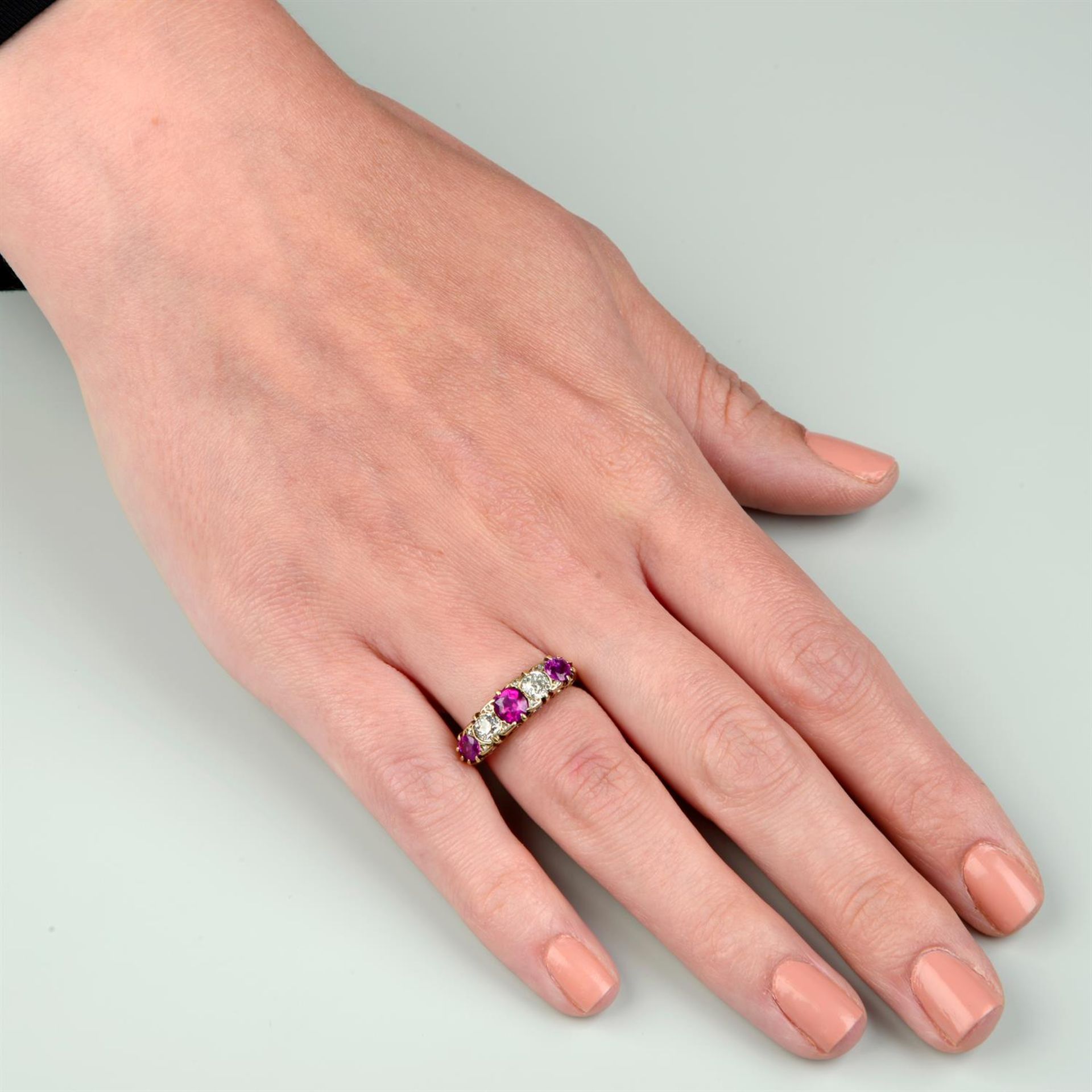 An early 20th century 18ct gold alternating ruby and old-cut diamond five-stone ring. - Image 5 of 5