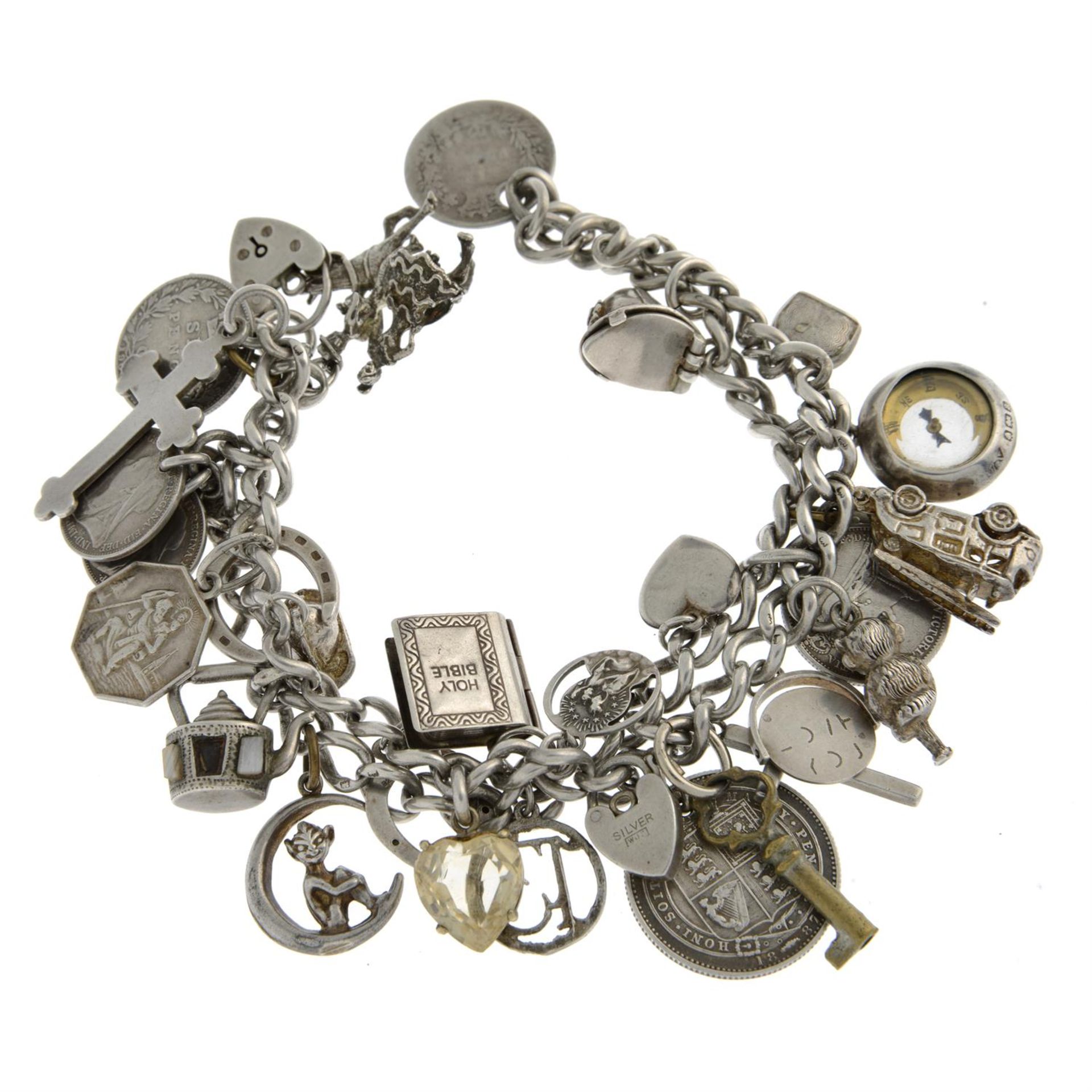 A silver two-row curb-link bracelet, suspending a selection of charms. - Image 2 of 2