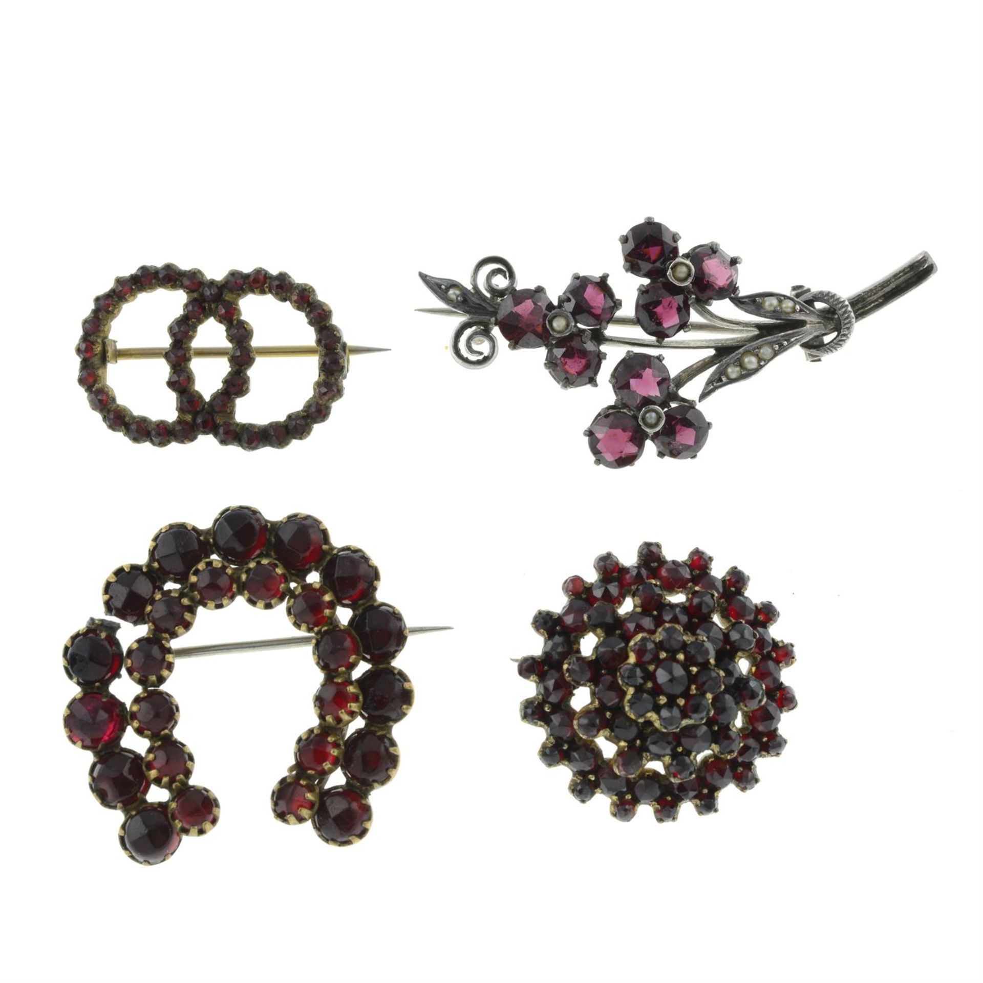 Four Victorian garnet brooches, to include a garnet and split pearl floral bouquet brooch.