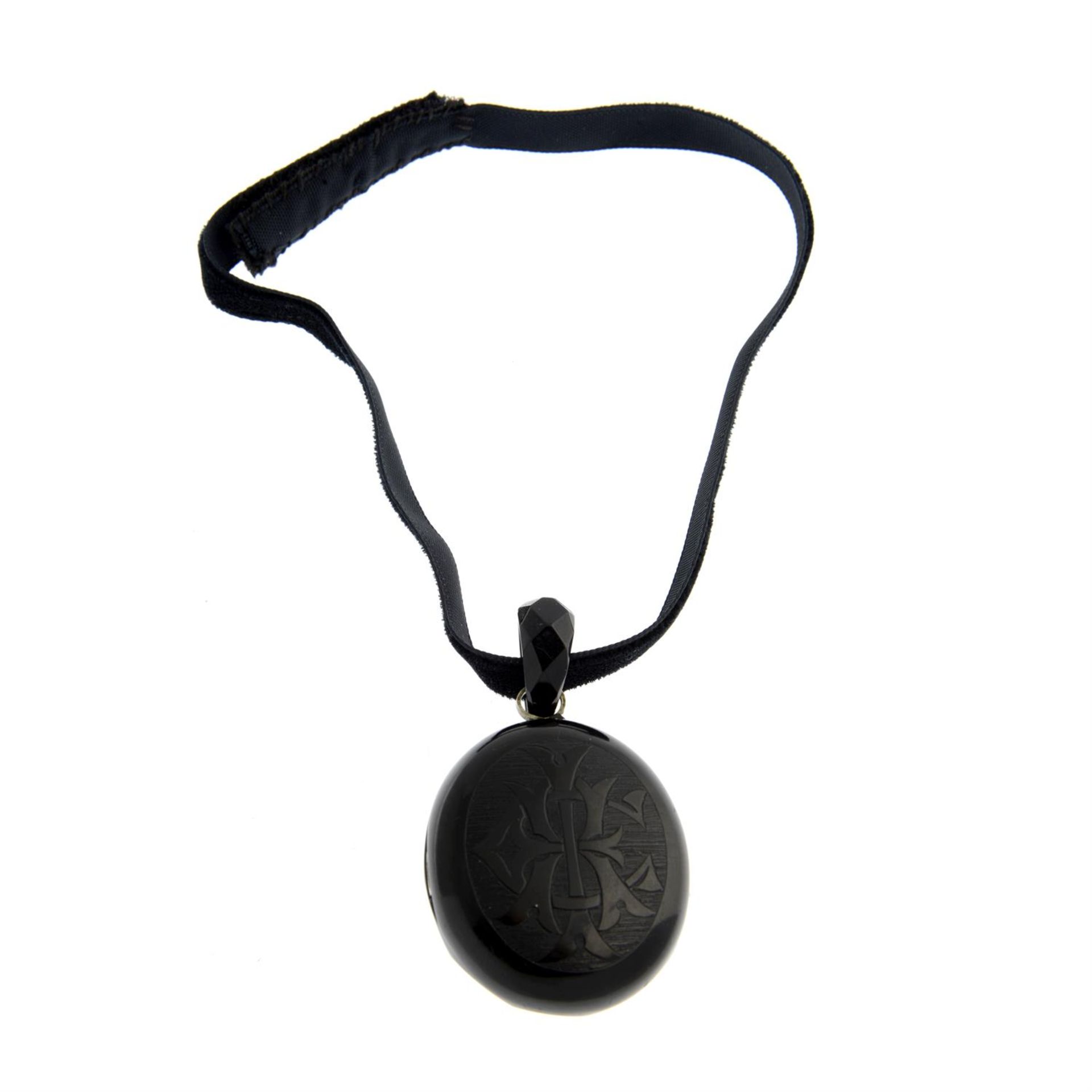 A late Victorian jet monogram locket pendant, suspended from a later velvet choker. - Image 2 of 4