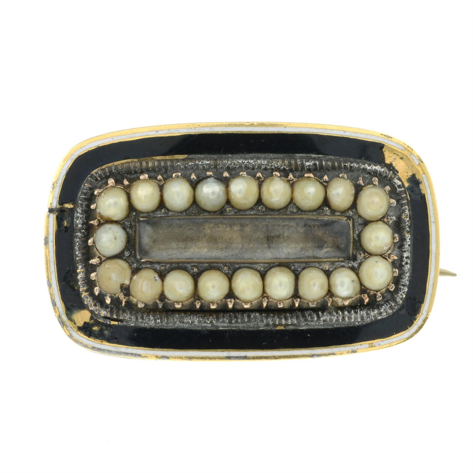 A Georgian split pearl and black enamel mourning brooch.