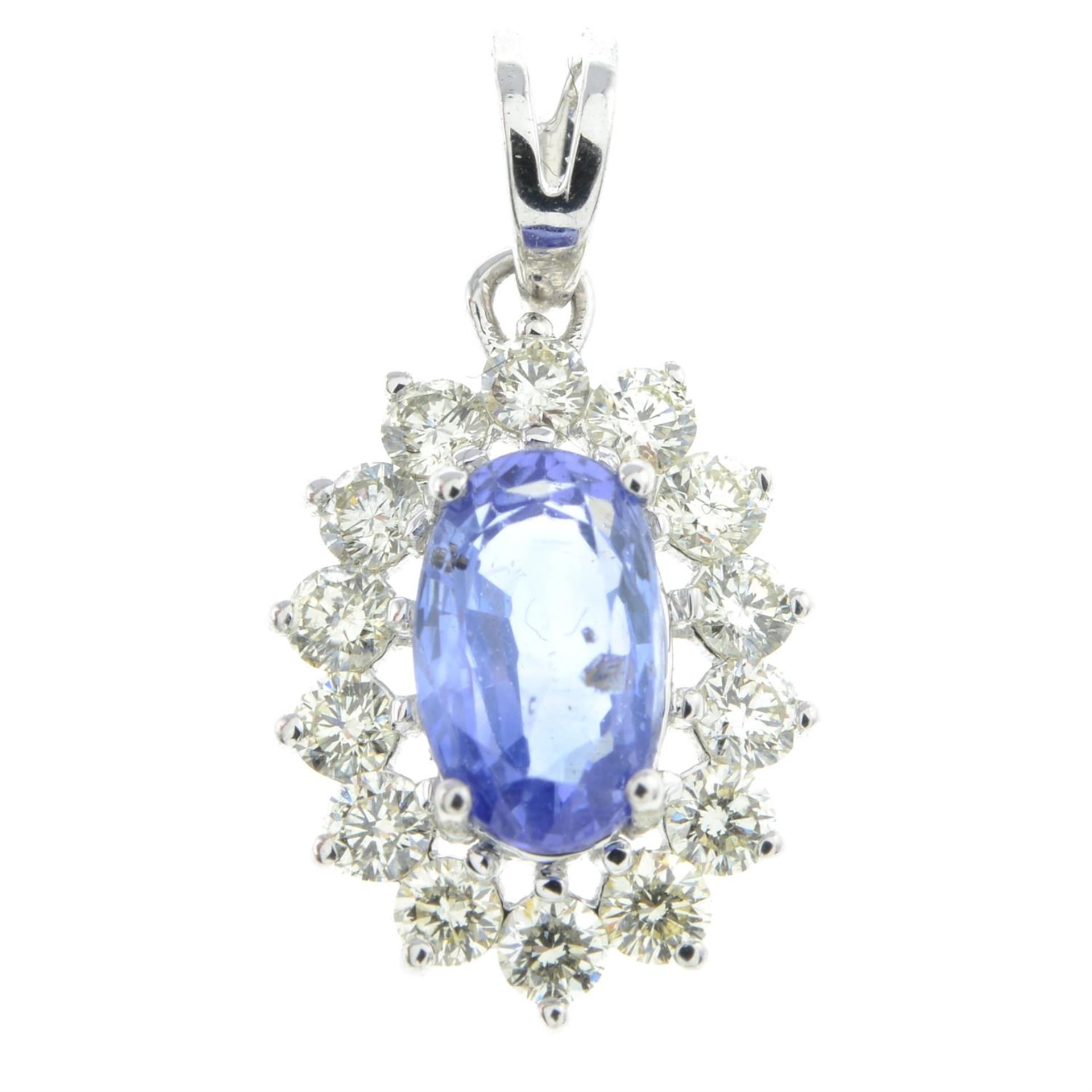 A sapphire and brilliant-cut diamond cluster pendant.