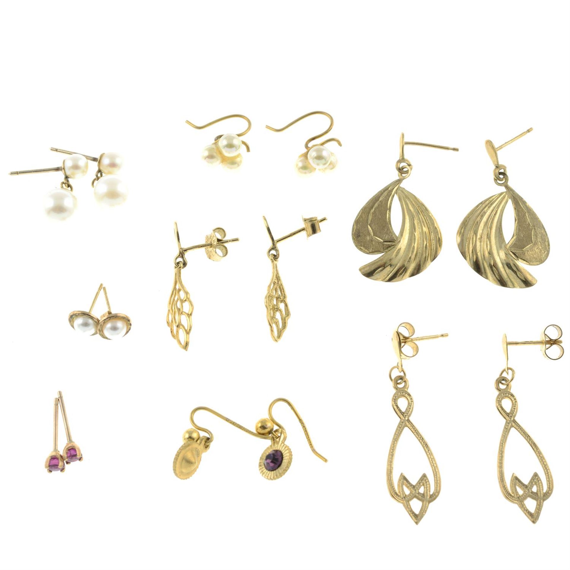 Eight pairs of earrings.