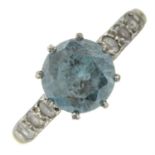 A mid 20th century blue zircon single-stone ring, with colourless gem sides.