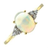 A 9ct gold opal single-stone ring with brilliant-cut diamond sides.