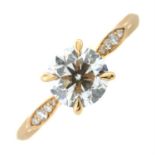 An 18ct gold brilliant-cut diamond single stone ring, with diamond shoulders.
