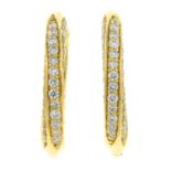 A pair of 18ct gold pave-set diamond hoop earrings.