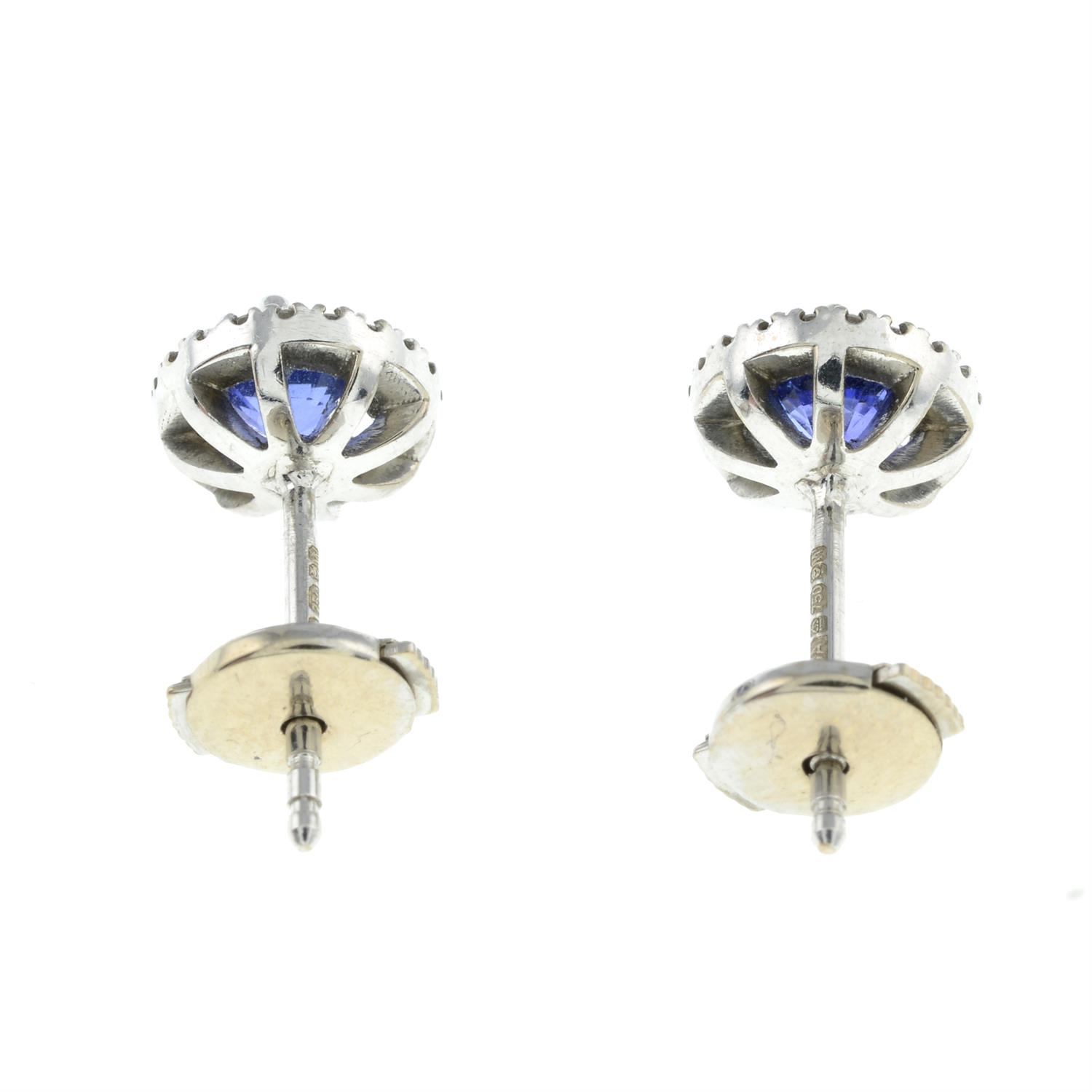 A pair of 18ct gold sapphire and brilliant-cut diamnd cluster stud earrings. - Image 2 of 2