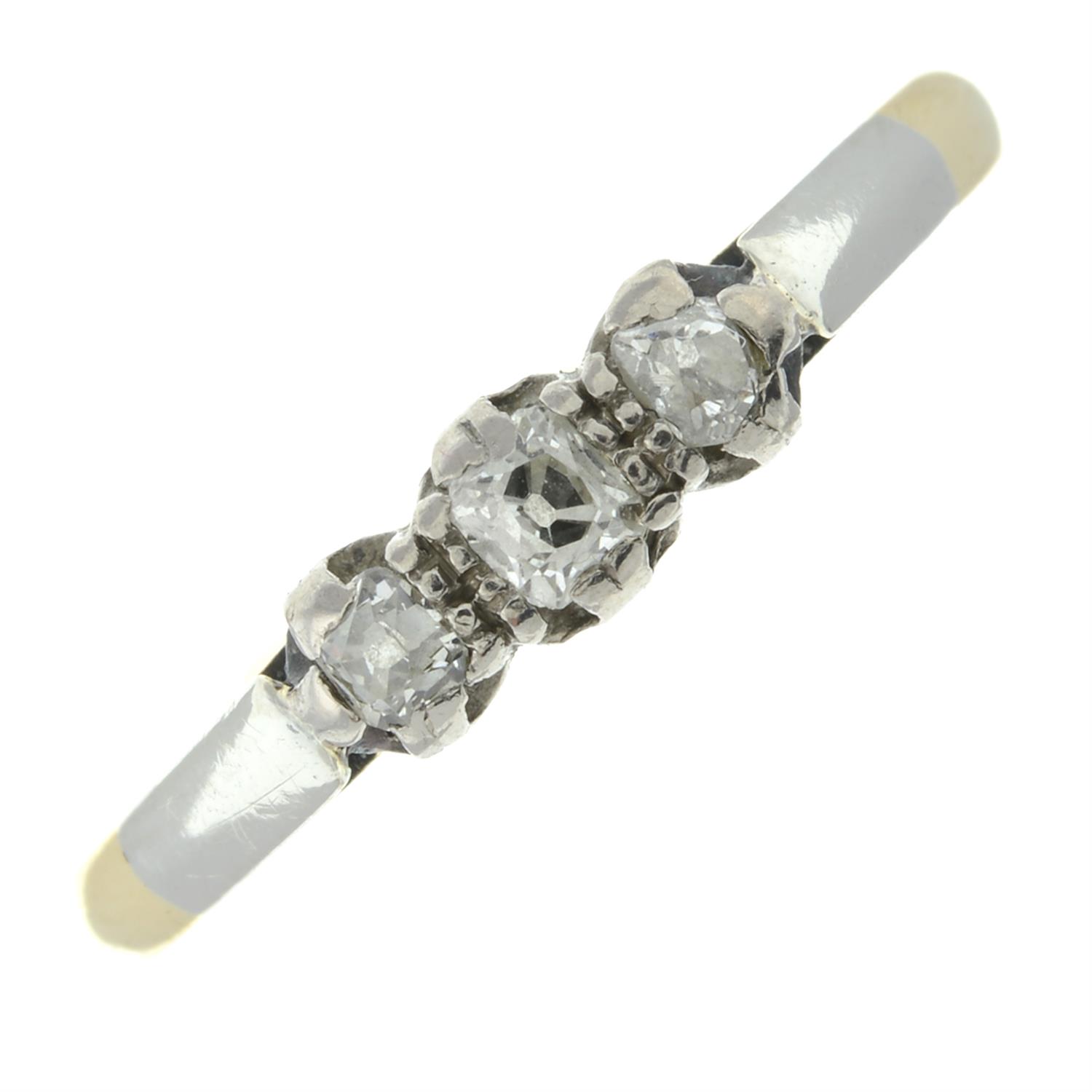 A mid 20th century 18ct gold and platinum old-cut diamond three-stone ring.