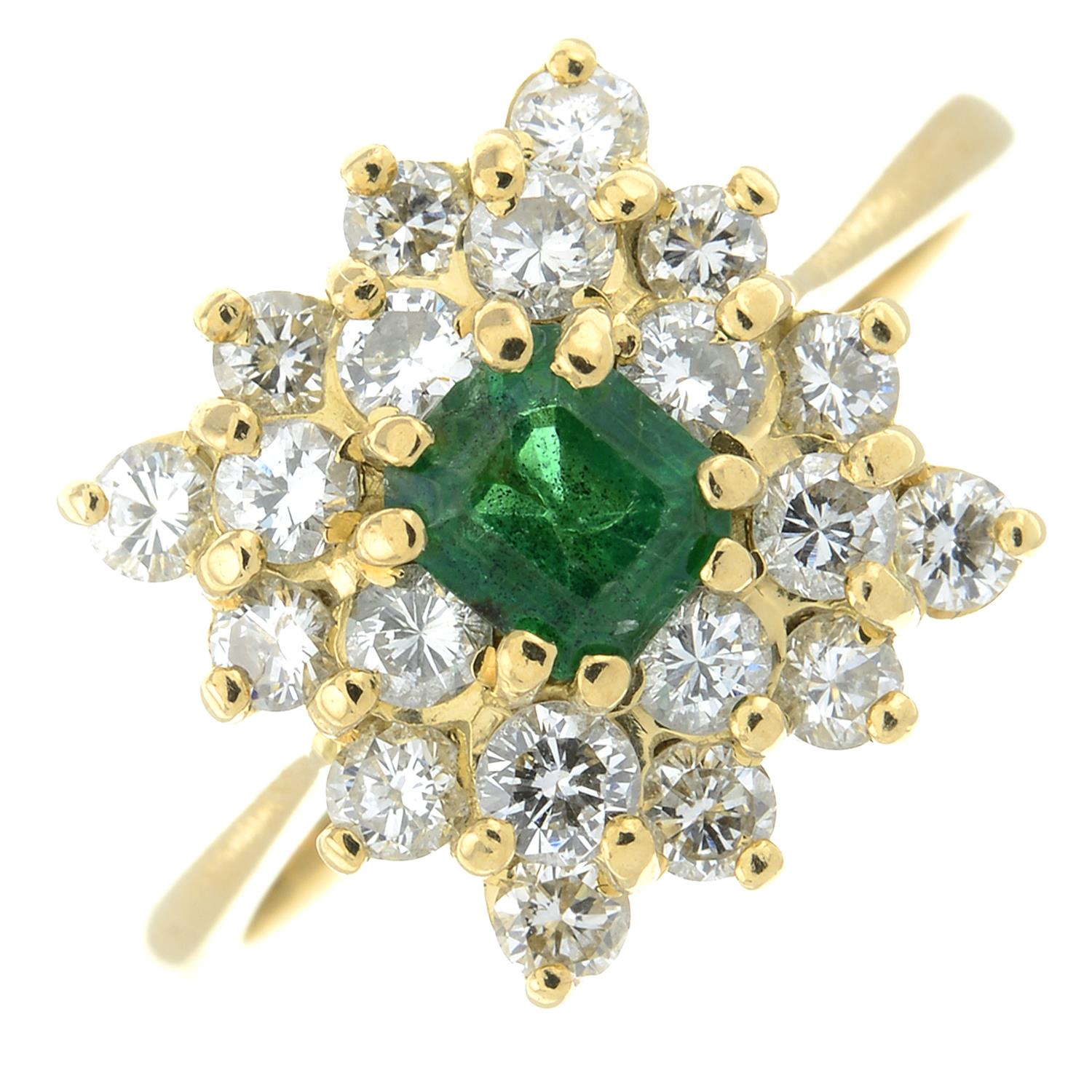 An emerald and brilliant-cut diamond cluster ring.