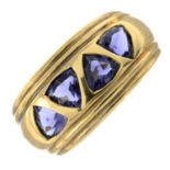A 9ct gold triangular-shape tanzanite four-stone band ring.