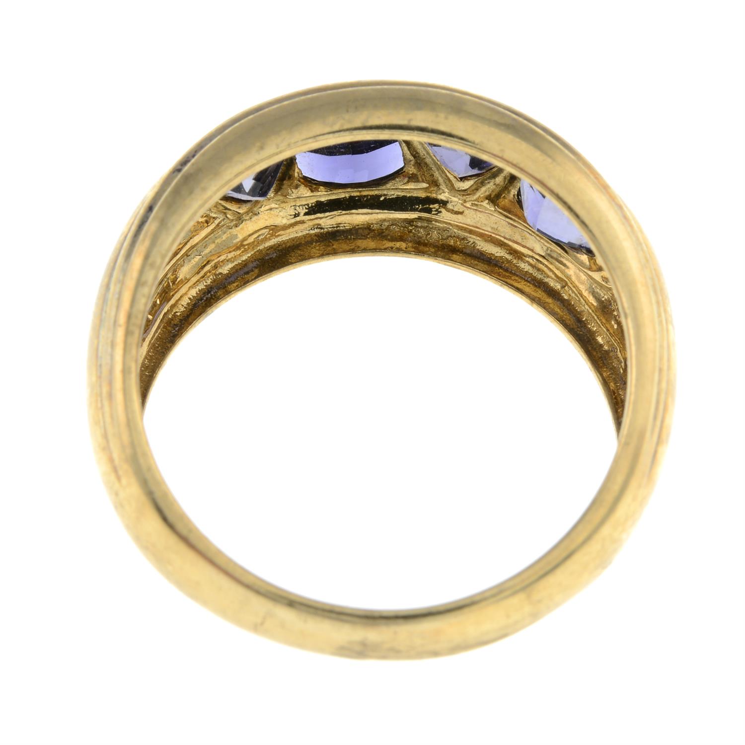 A 9ct gold triangular-shape tanzanite four-stone band ring. - Image 2 of 2