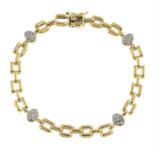 A fancy-link bracelet, with brilliant-cut diamond cluster spacers.