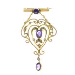 An Edwardian 9ct gold fob brooch, with amethyst and split pearl openwork drop.