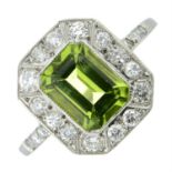 A rectangular-shape peridot and brilliant-cut diamond cluster ring.