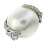 A mabe pearl dress ring, with single-cut diamond scrolling highlights.