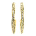 A pair of 18ct gold brilliant-cut diamond half hoop earrings.
