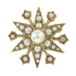 A 9ct gold split pearl starburst brooch/pendant.