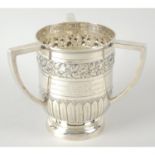 An Edwardian silver three-handled trophy by Mappin & Webb.