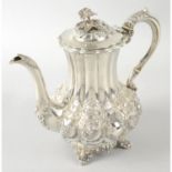 An early Victorian silver coffee pot.