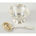 A late Victorian silver pierced small basket; together with a Russian silver sifter spoon. (2).