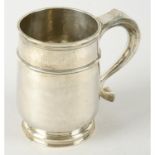 A Queen Anne Britannia silver mug.