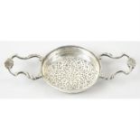 A 1930's silver lemon strainer.