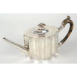 A George III silver fluted teapot.