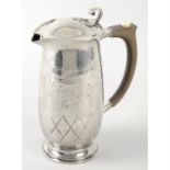 A Liberty & Co silver lidded jug.