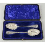 A cased pair of Edwardian silver spoons.