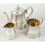 A mid-Victorian silver three piece tea set.