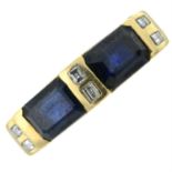 A sapphire dress ring, with diamond accents.