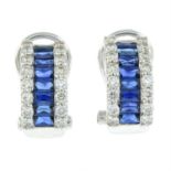 A pair of 18 carat gold diamond and sapphire set hoop earrings.