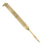 A 9ct gold retractable toothpick.