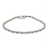 A 9ct gold single-cut diamond and sapphire line bracelet.