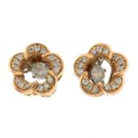 A pair of brilliant-cut diamond floral stud earrings, with central brilliant-cut diamond drop.