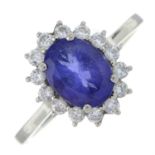 A platinum tanzanite and diamond oval-shape cluster ring.