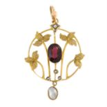 An Edwardian 9ct gold garnet and split pearl foliate motif openwork pendant, with mother of pearl