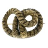 A Victorian twisted rope brooch.