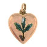 An early 20th century 9ct gold heart-shape pendant, with green enamel thistle detail.