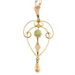 An Edwardian peridot openwork pendant, with 9ct gold chain.