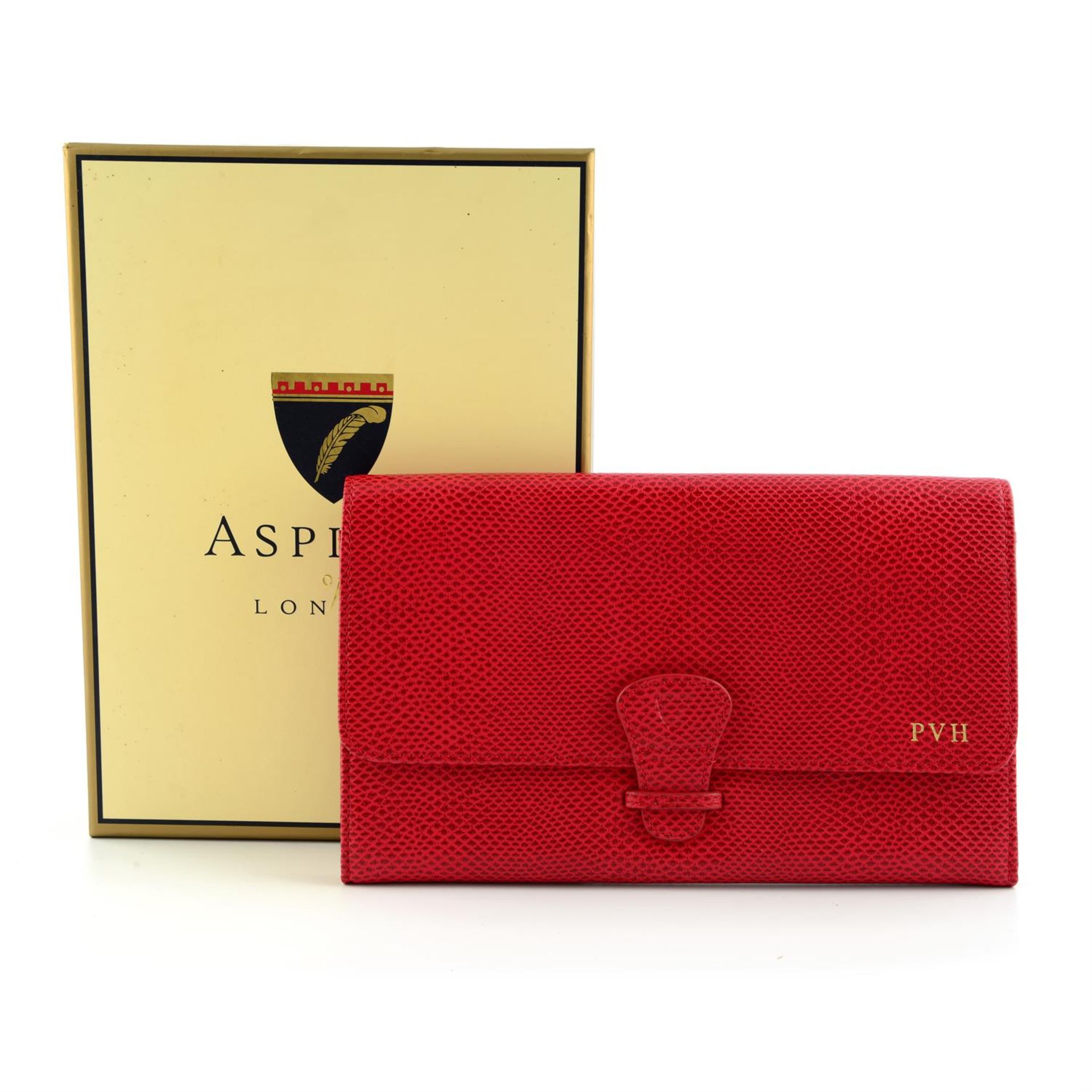 ASPINAL OF LONDON - a red embossed leather document holder.