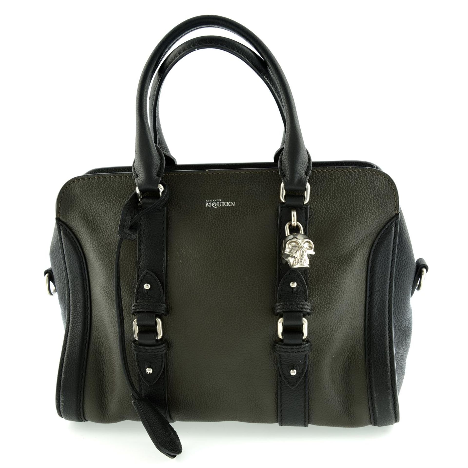 ALEXANDER MCQUEEN - a khaki and black leather handbag.