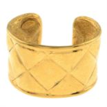 CHANEL - a Matelassé cuff bangle.