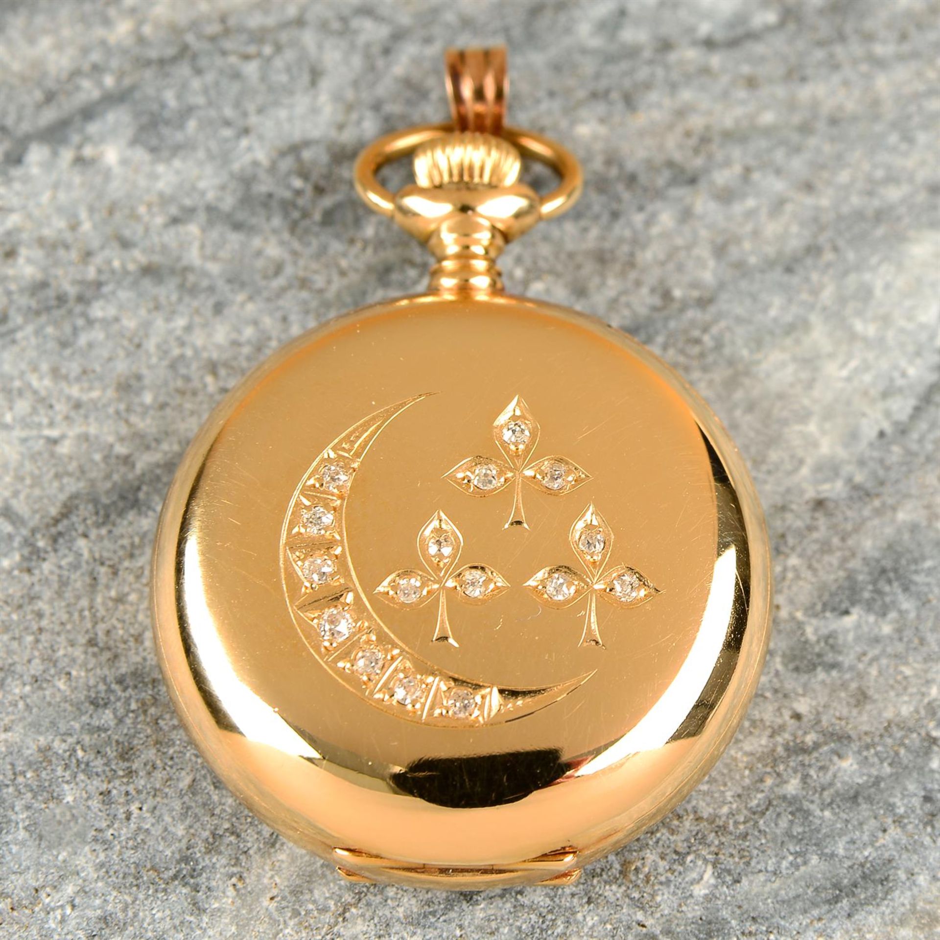 An early 20th century 14ct gold pocket watch, with old-cut diamond crescent moon and clover